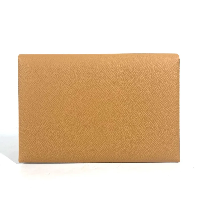 Handle bags with detachable pouches for versatility -Handle bags with leather straps for durability -Hermes  Leather Clutch Bag (Pre-Owned)