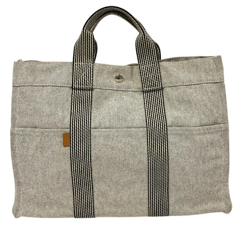 Handle bags with drawstring accents for style -Handwoven handle bags for a boho-chic style -Hermes  Canvas Tote Bag (Pre-Owned)