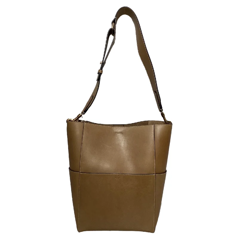 Handle bags with sleek hardware for sophistication -Small handle bags for a night out on the town -Celine Soft Sangle Bucket Bag in Brown Calfskin Leather