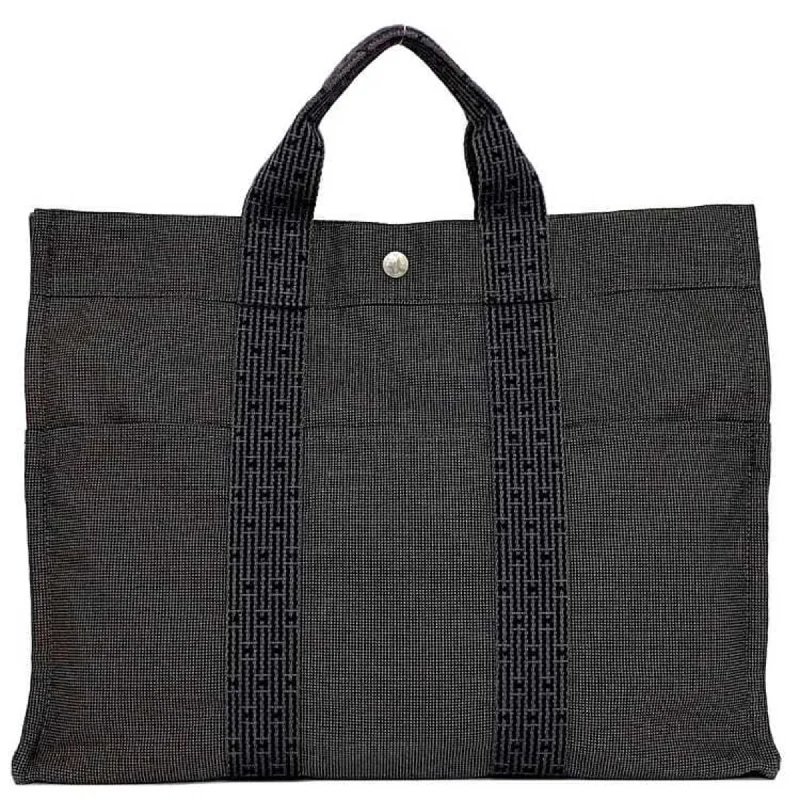 Handle bags with waterproof lining for protection -Handle bags with textured finishes for added flair -Hermes  Canvas Tote Bag (Pre-Owned)