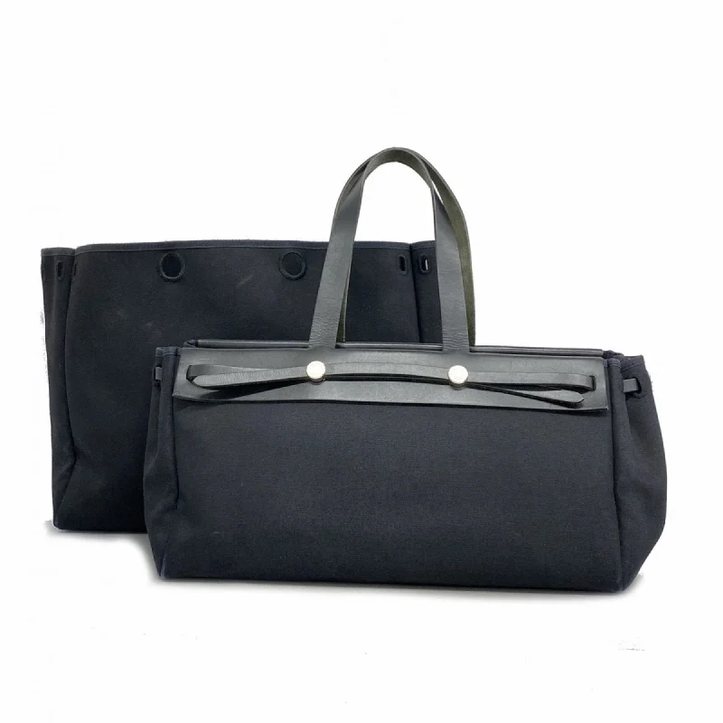 Handle bags with expandable sides for flexibility -Handle bags with decorative tassels for added detail -Hermes  Toile Officier Box Calf Leather Tote Bag (Pre-Owned)