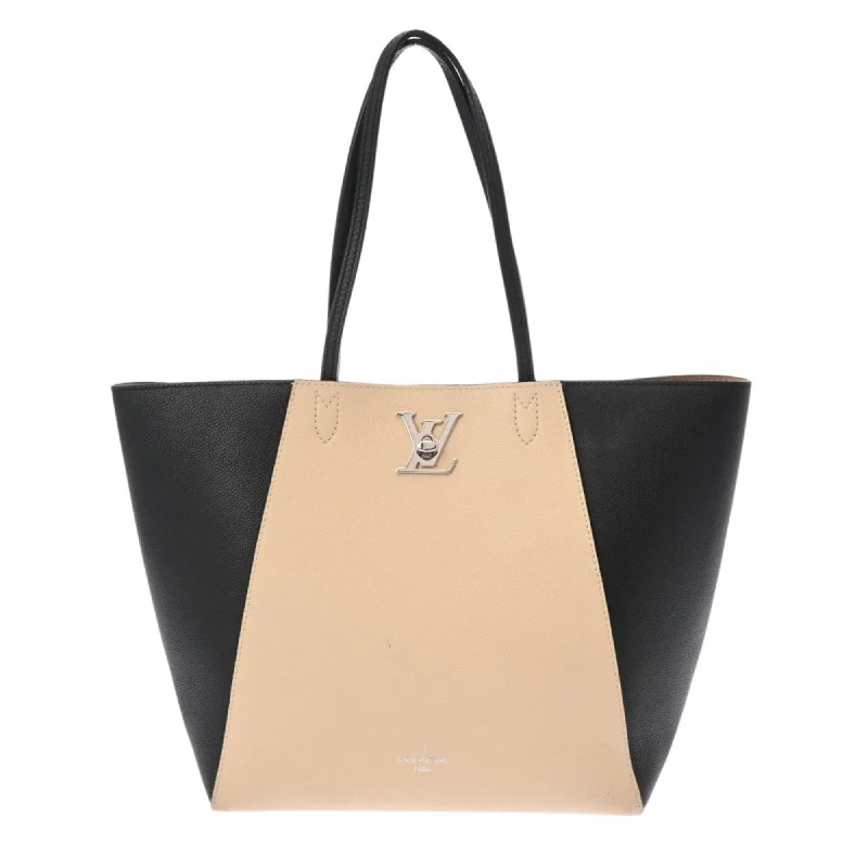 Handle bags with perforated details for style -Handle bags with leather detailing for a sophisticated touch -Louis Vuitton  Leather Tote Bag (Pre-Owned)