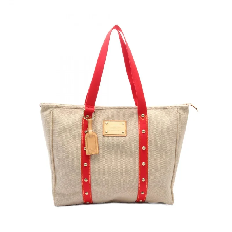 Handle bags with elegant gold-tone hardware -Handle bags with sleek silhouettes for a minimal style -Louis Vuitton Antigua   Color Canvas Tote Bag (Pre-Owned)