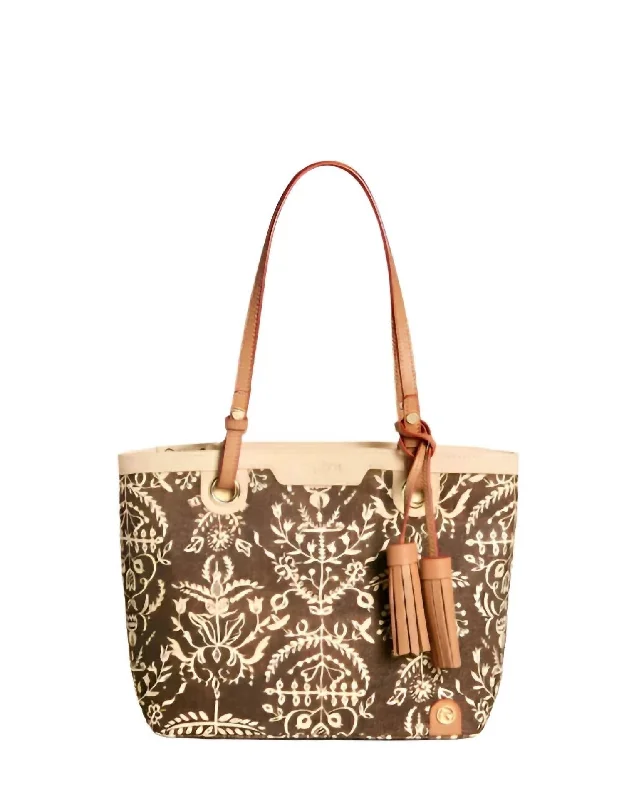 Handle bags with expandable sides for flexibility -Handle bags with decorative tassels for added detail -1859 Lighthouse Island Tote Bag In Multi