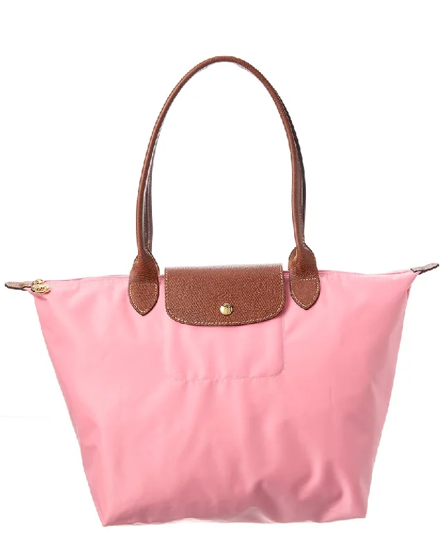 Handle bags with animal prints for flair -Structured handle bags for a sophisticated look -Longchamp Le Pliage L Tote