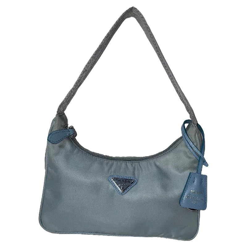 Handle bags with neutral tones for versatility -Handle bags for office wear with organized interiors -Prada Re-Edition 2000 Mini Bag in Light Blue Nylon