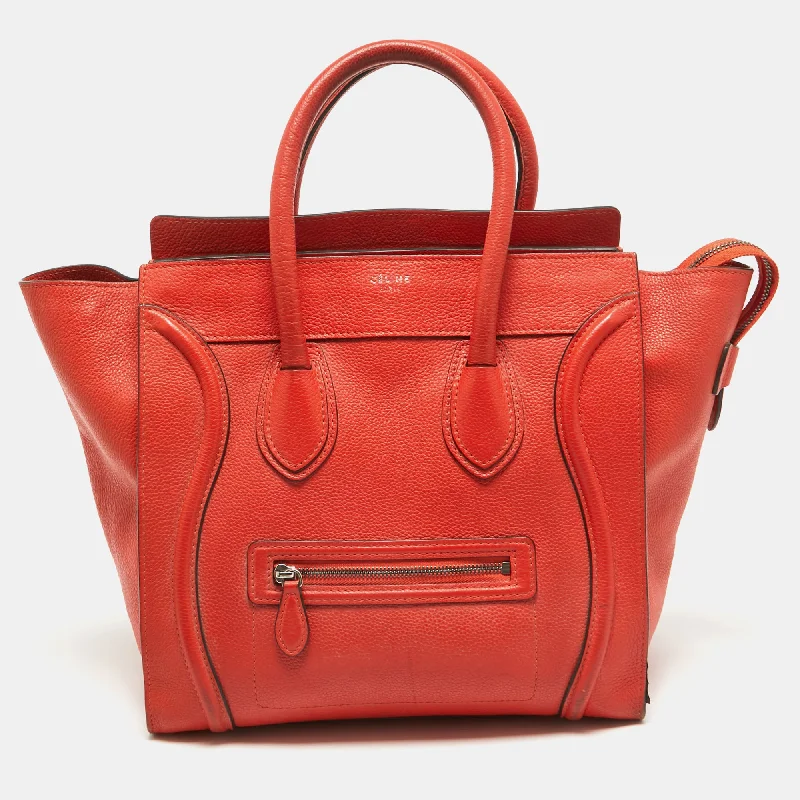 Handle bags with thick handles for support -Eco-friendly handle bags for conscious fashion -Celine Orange Leather Mini Luggage Tote