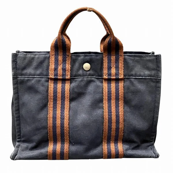 Handle bags with subtle embroidery for detail -Retro handle bags for a vintage-inspired outfit -Hermes Canvas Fourre Tout PM Tote Bag