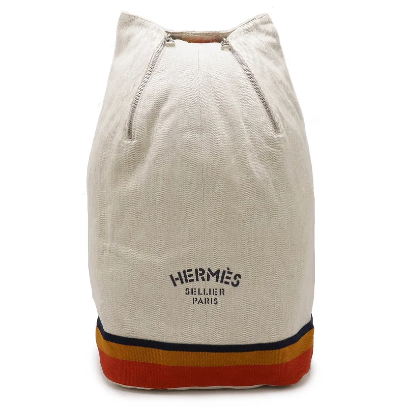 Handle bags with vintage clasps for nostalgia -Handle bags with fabric detailing for a casual yet chic look -Hermes Canvas Cavalier Shoulder Bag