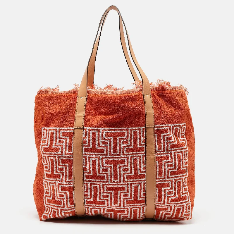 Handle bags with soft fabric for comfort -Handle bags with fringe details for a trendy vibe -Tory Burch Orange/white Terry Cloth And Leather Printed Tote